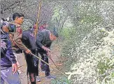  ?? ?? Police search the forest area to look for other body parts of victim Shraddha Walker, in Mehrauli, New Delhi on Friday.