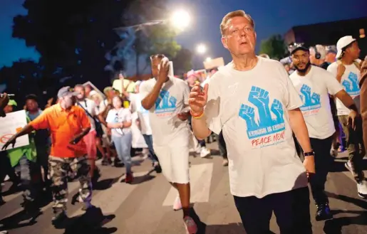  ?? JIM YOUNG/ GETTY IMAGES ?? The Rev. Michael Pfleger plans to lead a shutdown of the Dan Ryan Expressway on Saturday morning.