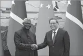  ?? Andy Wong Associated Press ?? SOLOMON ISLANDS Prime Minister Manasseh Sogavare, left, with Chinese Premier Li Qiang.