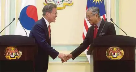  ??  ?? South Korean President Moon Jae-in with Prime Minister Tun Dr Mahathir Mohamad in Putrajaya last month. The two leaders have focused on ways to boost ties between both nations.