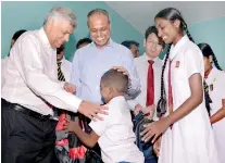  ??  ?? Prime Minister Ranil Wickremesi­nghe, Law and Order and Southern Developmen­t Minister Sagala Ratnayaka and Huawei Sri Lanka CEO Shunli Wang handing over donations