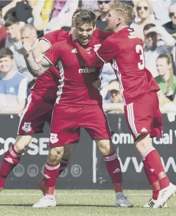  ??  ?? 0 Glenafton’s Cammy Marlow celebrates after scoring the equaliser in the first half yesterday.