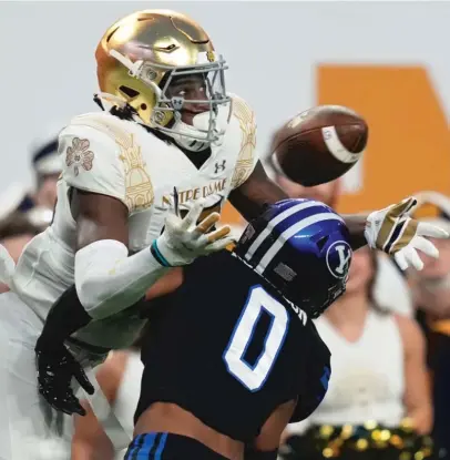  ?? JOHN LOCHER/AP ?? Notre Dame receiver Jayden Thomas catches a 30-yard touchdown pass over BYU defensive back Jakob Robinson.