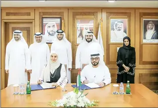  ?? KUNA photo ?? Ajman Chamber of Commercean­d Industry and Kuwait Business Council sign a MoU.