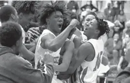  ?? JOHN MCCALL | SOUTH FLORIDA SUN SENTINEL ?? Players from Forest Hill celebrate Friday after beating Wellington in the District 10-7A final in West Palm Beach.