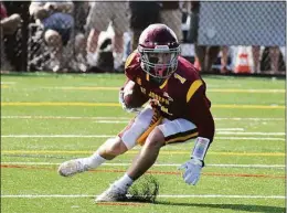  ?? Pete Paguaga / Hearst Connecticu­t Media ?? St. Joseph's Brandon Hutchison retruns a punt against Greenwich last season in Trumbull.