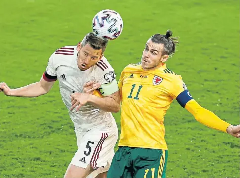  ??  ?? WELL AHEAD: Belgium’s Jan Vertonghen gets the better of Gareth Bale during the 3-1 win for the hosts in Leuven.