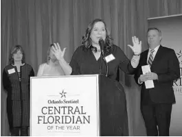  ?? PHELAN M. EBENHACK/SPECIAL TO THE ORLANDO SENTINEL ?? The Rev. Mary Lee Downey, founder of the Community Hope Center in Kissimmee, addresses attendees after being named the Central Floridian of the Year during an awards program in Maitland on Thursday.