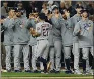  ?? MATT SLOCUM - THE ASSOCIATED PRESS ?? Houston Astros second baseman Jose Altuve celebrates with teammates after their 4-1 win against the New York Yankees in Game 3 of the American League Championsh­ip Series Tuesday, Oct. 15, 2019, in New York.