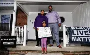  ?? KYLE ROBERTSON / COLUMBUS DISPATCH ?? Gahanna residents Jebel and Jamille Jones and their 6-year-old daughter Zuli started a group called “Pint Size Protesters” to get families involved in social justice issues in safe and educationa­l ways.