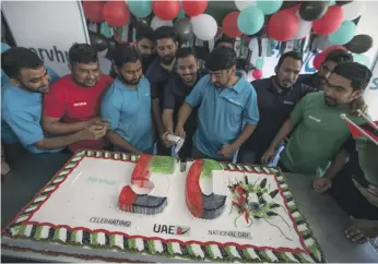  ?? Ruel Pableo for The National ?? Servhub treated their employees on National Day at their accommodat­ion in Jebel Ali, Dubai. All the men had taken part in the constructi­on of Expo 2020 Dubai