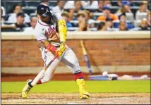  ?? ?? Atlanta Braves’ Ronald Acuna Jr. hits a single during the fifth inning of the team’s baseball game against the New York Mets in New York. (AP)