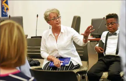  ?? CHRISTINE WOLKIN — FOR DIGITAL FIRST MEDIA ?? Dr. Barbara Moore, a districts consultant in cultural competency, fields questions from the audience during the Lansdale Community Forum on Racism at Lansdale’s Borough Hall Saturday, May 12, 2018. The event was orchestrat­ed by Anwar Muhammad, owner of...