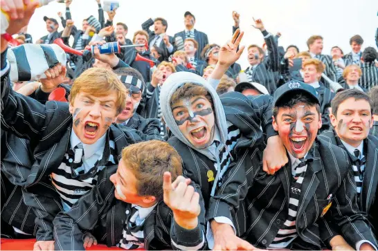  ?? Photo / Photosport ?? Christ’s College supporters celebrate in 2017 after ending their 16-year winless streak against Christchur­ch Boys’ High.
