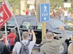  ?? Picture: AP ?? President Donald Trump waves as he drives past supporters gathered outside the Walter Reed National Military Medical Center in Bethesda,on Sunday.