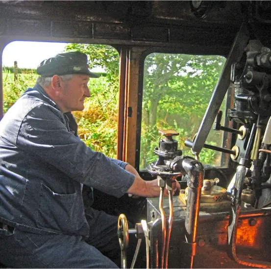  ?? ?? ABOVE Chris Cubitt in the cab of visiting ‘Britannia’ No. 70013 Oliver Cromwell. JOHN HUNT