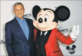  ?? Valerie Macon AFP/Getty Images ?? DISNEY’S BOARD said Sunday that former longtime Chief Executive Robert Iger had agreed to return for two years, replacing his successor, Bob Chapek.