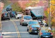  ?? CATHY ZURAW /HEARST CONNECTICU­T MEDIA VIA AP) ?? State police search the area around a home reportedly belonging to a friend of Kyle Navin on Friday in Weston. Possible human remains were found during the search and may be linked to the disappeara­nce of a missing Easton couple.