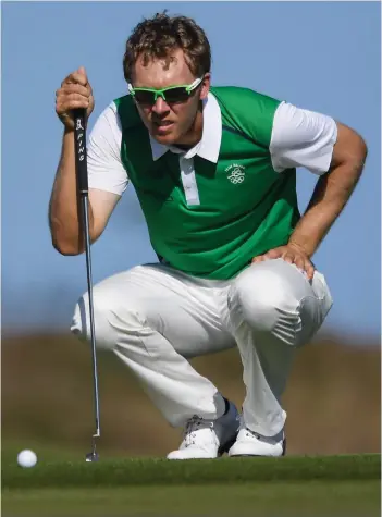  ??  ?? Green giant: Seamus lines up a putt during the 2016 Olympics in Rio