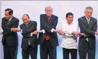  ?? AP PHOTO ?? Leaders, from left, Thailand’s Prime Minister Prayuth Chan-ocha, Vietnam’s Prime Minister Nguyen Xuan Phuc, U.S. President Donald Trump, Philippine President Rodrigo Duterte and Singapore’s Prime Minister Lee Hsien Loong pose for a family photo during...