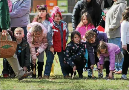  ?? KRISTI GARABRANDT — THE NEWS-HERALD ?? Children wait at the starting line to take part in the Easter Monday Egg Roll April 2 at the James A. Garfield Historic Site in Mentor.