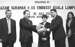  ??  ?? Wong (second left) receives a memento from US Embassy Kuala Lumpur senior program specialist Sadayan Riazurrahm­an, as (from left( Ismawi, Azam acting CEO Leila Sim and Rekha look on.