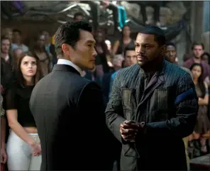  ??  ?? Jack Kang (Daniel Dae Kim) and Max (Mekhi Phifer) parlay in a scene from the underperfo­rming dystopian young adult drama The Divergent Series: Allegiant — Part 1.