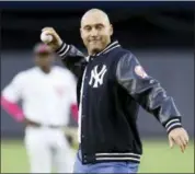  ?? KATHY WILLENS — THE ASSOCIATED PRESS ?? Retired New York Yankees shortstop Derek Jeter throws out the ceremonial first pitch after a ceremony retiring his number 2 in Monument Park at Yankee Stadium in New York, Sunday.