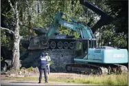  ?? AP PHOTO/SERGEI STEPANOV, FILE ?? FILE - Workers remove a Soviet T-34tank installed as a monument in Narva, Estonia, Aug. 16, 2022. Russia’s invasion of Ukraine has led to a renewed push to topple the last remaining monuments to the Soviet army that remained in Europe.