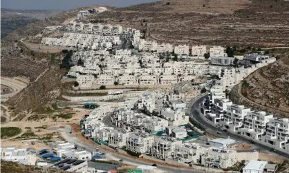  ?? Photograph: Ammar Awad/Reuters ?? Settlement buildings around Givat Ze’ev in the Israeli-occupied West Bank.