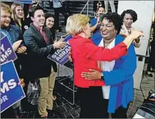  ?? John Amis EPA/Shuttersto­ck ?? D E M O C R AT Stacey Abrams, right, whose campaign accuses Kemp of “maliciousl­y wielding the power of his office to suppress the vote.”