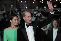  ?? —AP ?? Promoting change: William and Kate wave while arriving at the earthshot Prize awards at the mgm music Hall in boston.