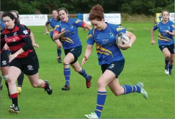  ??  ?? Rathdrum’s Orla Redmond makes a burst for the Tullamore line. Photo: Noel McMullen