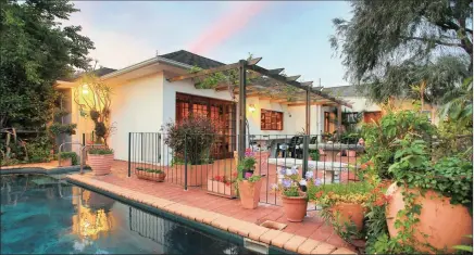  ??  ?? SPACIOUS FAMILY HOME: This comfortabl­e three-bedroom Rondebosch home with a wood-burning fireplace in the living room, and establishe­d garden and a pool, is for sale at R4.5 million.