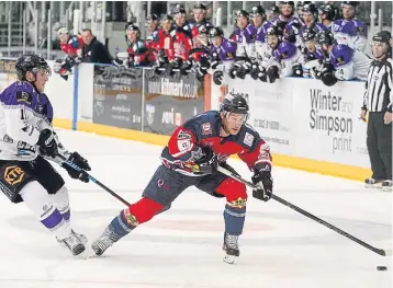  ??  ?? Stars’ Joey Sides powers past Clan’s Matt Haywood.