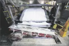  ?? STEVE MARCUS/LAS VEGAS SUN ?? TECHNICAL GRADE LITHIUM CARBONATE comes off a conveyor belt during a tour of the Silver Peak lithium mine on Jan. 30, 2017, near Tonopah, Nev.