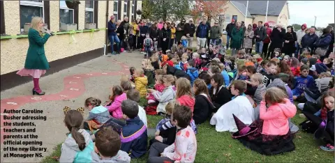  ??  ?? Author Caroline Busher adressing the students, teachers and parents at the official opening of the new library at Monageer NS.