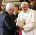  ?? THE ASSOCIATED PRESS ?? Pope Francis shakes hands with Palestinia­n President Mahmoud Abbas during a private audience at the Vatican, Saturday.