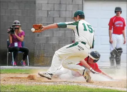  ?? GENE WALSH — DIGITAL FIRST MEDIA ?? Souderton’s Mitch Amenta steals home on a pass ball as Pennridge’s Ian Kacergis reaches for the throw during a Buxmont Legion contest Monday.