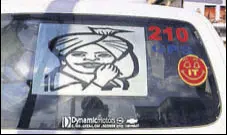  ?? PHOTOS: AMARJIT CHANDAN/SANDEEP SINGH ?? A moustache-twirling image of the freedom fighter on a vehicle, and (below) an imaginary depiction of Bhagat Singh’s sacrifice atop a temple building.