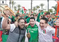  ?? Michael Owen Baker For The Times ?? MEXICO fans Pablo Lopez, left, CC Gerson and Pablo Lugo exult after their team scored its first goal in its 2-1 World Cup victory over South Korea.