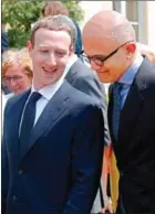  ?? CHARLES PLATIAU/AFP ?? Facebook CEO Mark Zuckerberg (left) and Microsoft CEO Satya Nadella leave after a picture with guests of the Tech for Good Summit at the Elysee Palace in Paris on Wednesday.