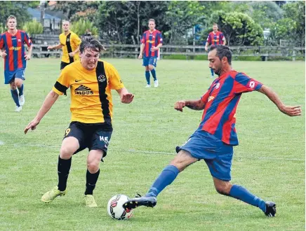  ?? Photo: PHOTOSPORT ?? Twisting and turning: WaiBop United striker Federico Marquez, right, tries to go past Team Wellington’s Cory Chettlebur­gh in Cambridge on Saturday.