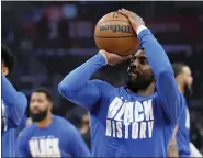  ?? AP PHOTO/ MARK J. TERRILL ?? Dallas Mavericks guard Kyrie Irving smiles as he warms up prior to an NBA basketball game against the Los Angeles Clippers Wednesday, Feb. 8, 2023, in Los Angeles.