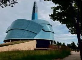  ?? FELICIA FONSECA/ASSOCIATED PRESS ?? At left, people walked by the museum on Aug. 13, 2023, in Winnipeg, Manitoba.