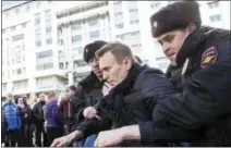  ?? EVGENY FELDMAN FOR ALEXEY NAVALNY’S CAMPAIGN PHOTO VIA AP ?? In this photo provided by Evgeny Feldman, Alexei Navalny is detained by police in downtown Moscow Sunday,