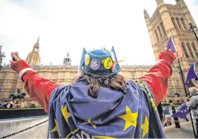  ?? PHOTO: CHRIS RATCLIFFE/ BLOOMBERG ?? Hard sell: An anti-Brexit protester outside the Houses of Parliament in London yesterday.