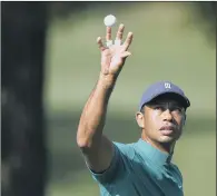  ?? PICTURE: AP PHOTO/ DAVID J. PHILLIP ?? EYES ON THE BALL: Defending champion Tiger Woods during practice for this year’s US Masters at Augusta.