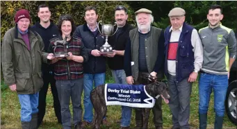  ??  ?? Ted Kenny and Maurice Brosnan presenting the Cup to Liam Dowling after his dog, Ballymac Vale, won the Derby Trial Stakes at Castleisla­nd Coursing on Monday. Photo by David O’Sullivan