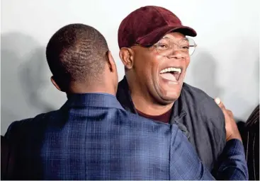  ?? MAX GERSH/THE COMMERCIAL APPEAL ?? Anthony Mackie, left, and Samuel L. Jackson share a laugh Monday before the premiere of “The Banker” at the National Civil Rights Museum in Memphis.